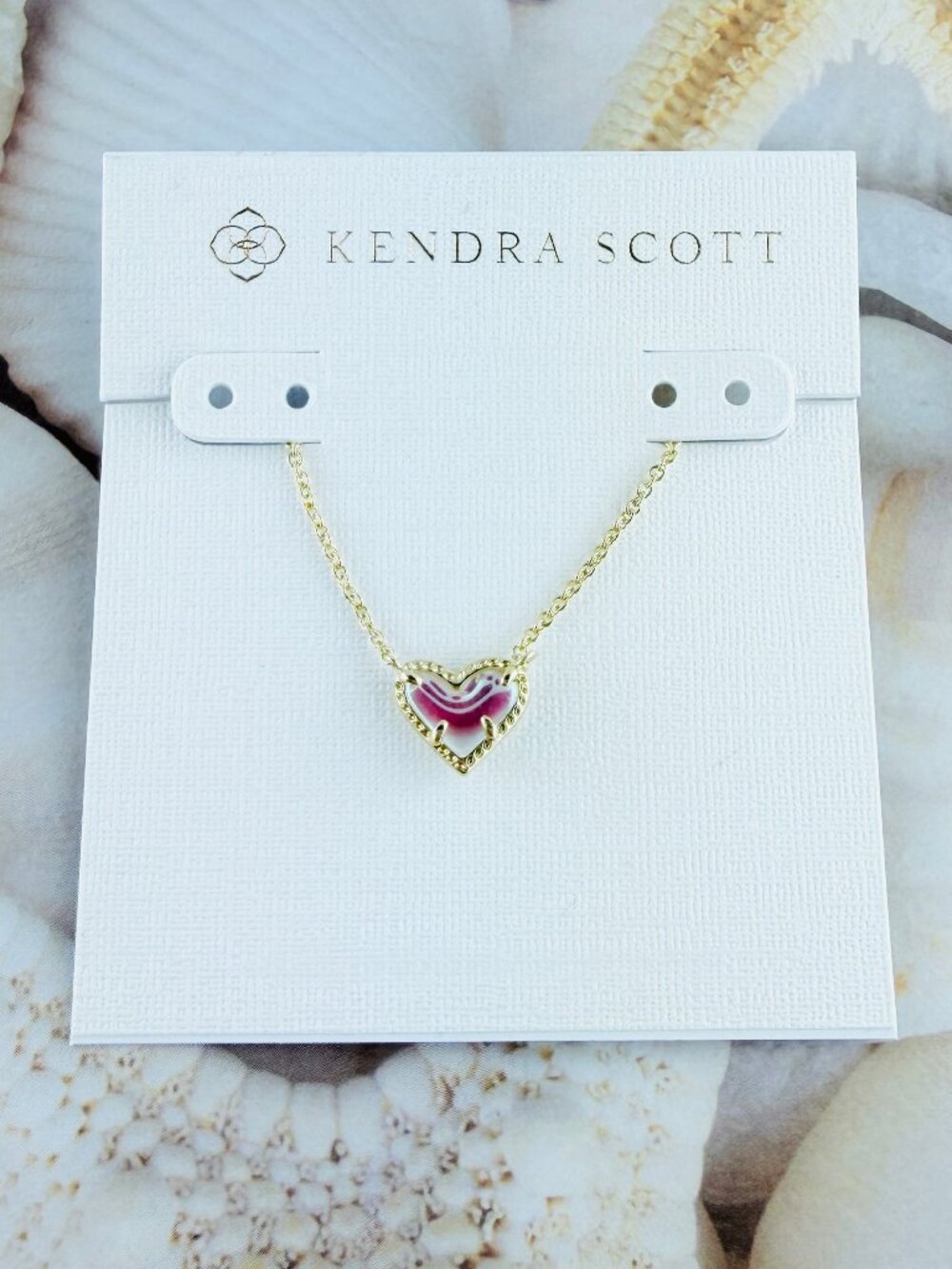 Kendra Scott Ari Heart Small Dichroic Glasd gold necklace.